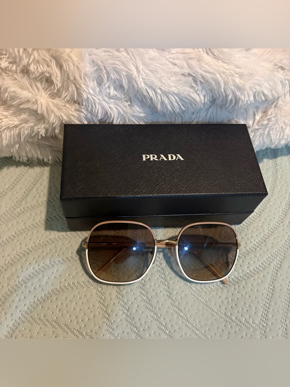 Prada Women's White Frame Sunglasses with Gold Accents
